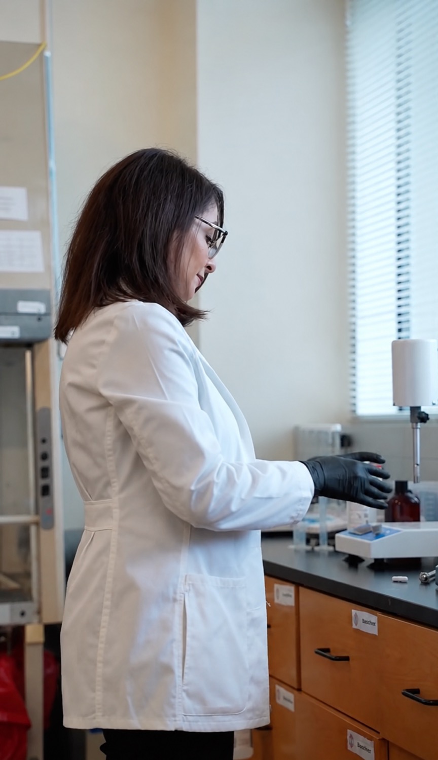 Dr. Maryam Alavi working at the laboratory bench